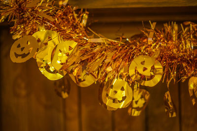 Close-up of yellow lights hanging