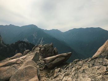 Rocks in mountains against sky