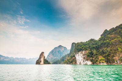 Scenic view of sea against cloudy sky