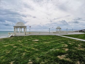 Built structure on beach against sky