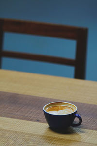 Close-up of coffee cup on table