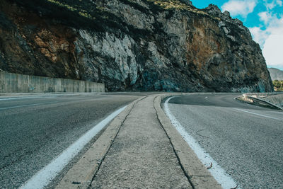 Surface level of road amidst rocks