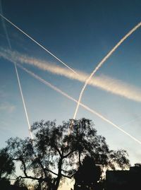 Low angle view of vapor trails in sky