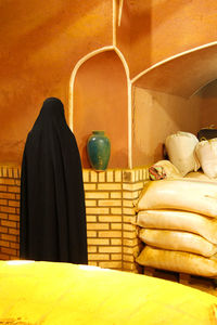 Rear view of people against wall