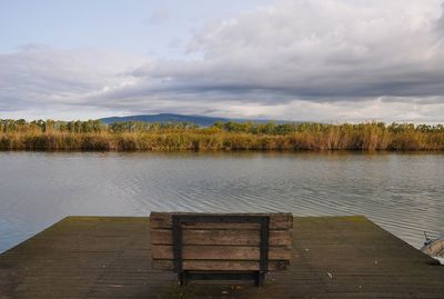 Pier over lake against sky