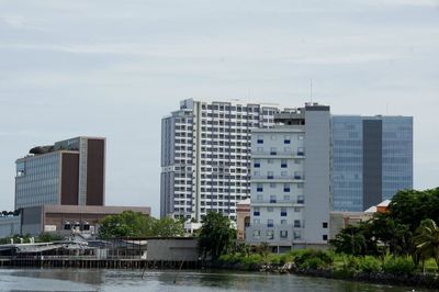 Buildings in city against sky