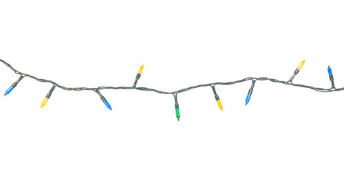 Close-up of multi colored hanging against white background