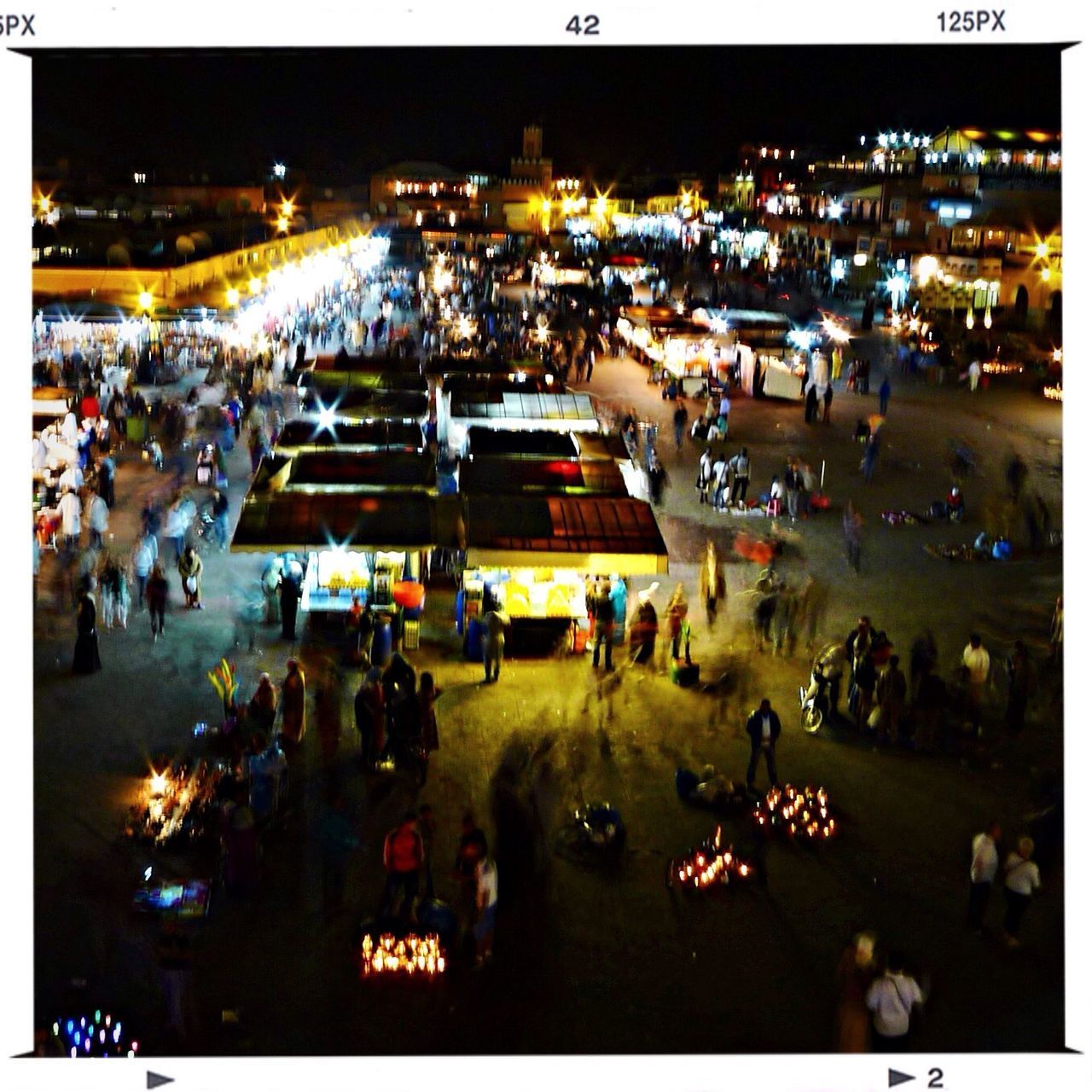 HIGH ANGLE VIEW OF PEOPLE ON STREET IN CITY