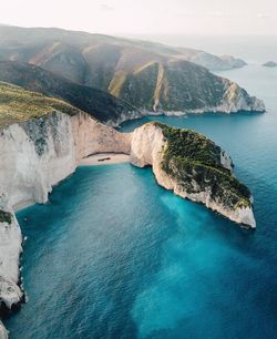 Aerial view of cliff by sea