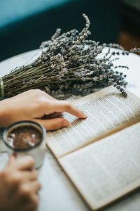 Close-up of hand holding book