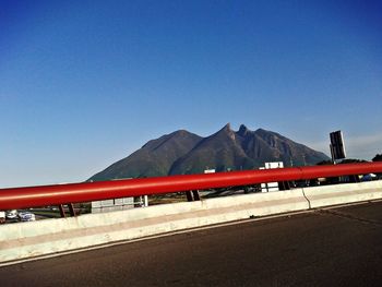 Panoramic view of mountains against clear blue sky