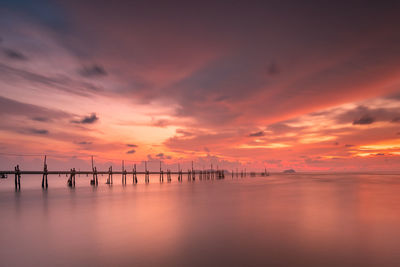 Scenic view of sea against orange sky