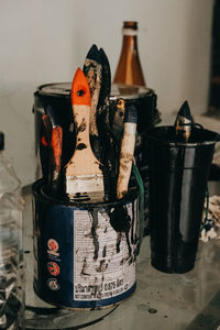 Close-up of objects on table against wall