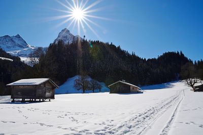 Scenic view of snow covered mountain against sky