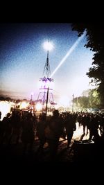 Silhouette of ferris wheel against sky at night