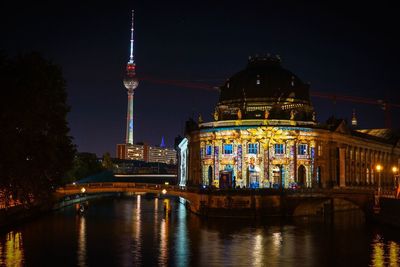 Illuminated buildings in city at night