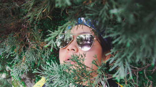 Portrait of young woman wearing sunglasses