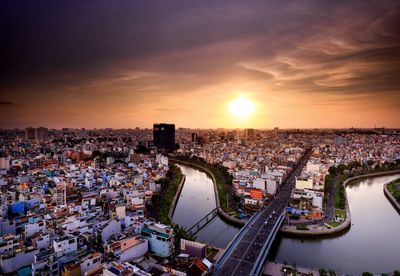 High angle view of city at sunset