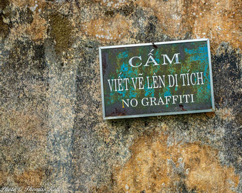 Close-up of text on wall