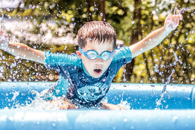 Boy swimming in pool