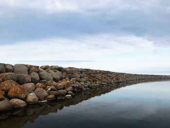 Rocks by sea against sky in Österlen, sweden