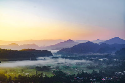 Scenic view of mountains against sky during sunset