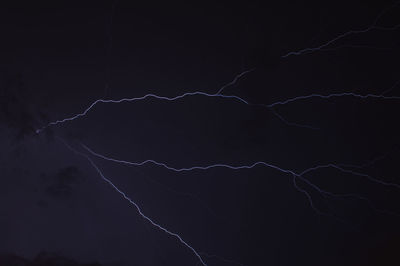 Low angle view of lightning in sky at night