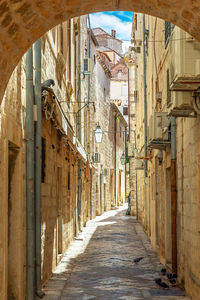 Narrow alley amidst buildings in city