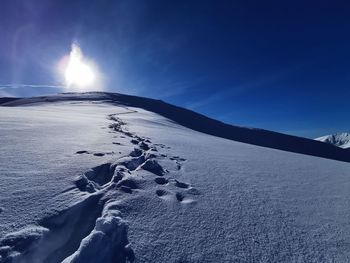 Scenic view of snow covered mountain against sky