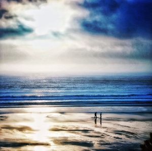 Scenic view of sea against cloudy sky