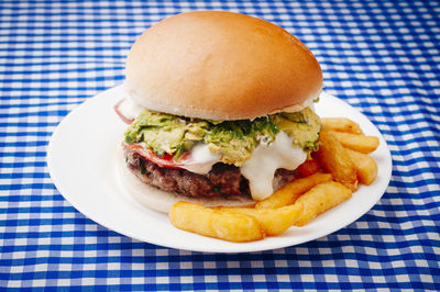 Close-up of burger in plate on table