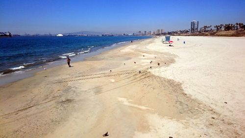 Scenic view of beach against clear sky