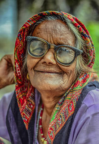 Close-up portrait of senior woman wearing eyeglasses