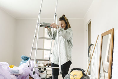 Woman renovating room