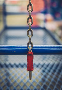 Close-up of key on broad chain