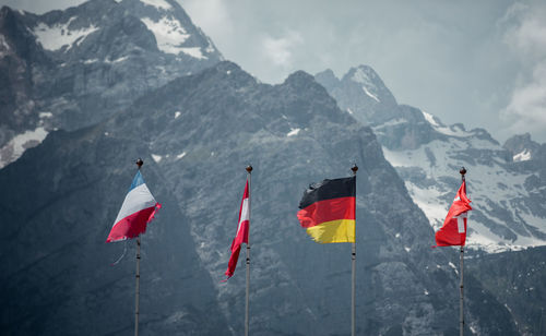 Flags against mountains