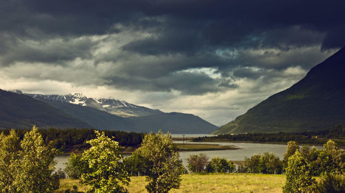 Scenic view of landscape and mountains against sky