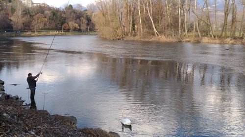 Man fishing in lake