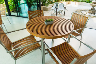 High angle view of empty chairs and table in restaurant