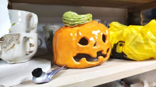 Close-up of jack o lantern on table