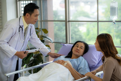 Doctor examining patient in office