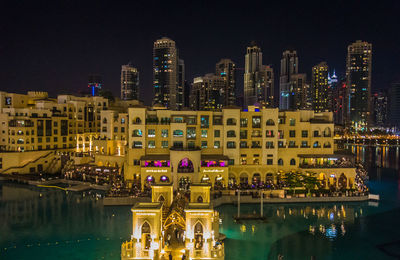 Illuminated buildings in city at night