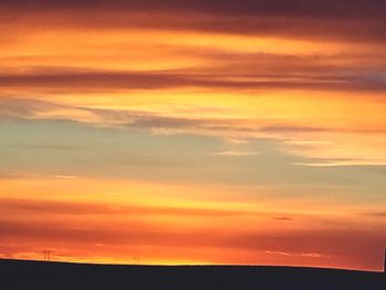 Scenic view of dramatic sky during sunset