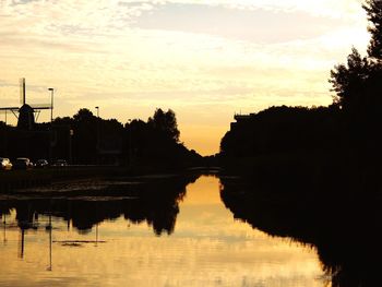 Scenic view of river at sunset