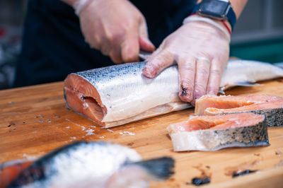 Midsection of man preparing food