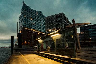 Train at railroad station against sky