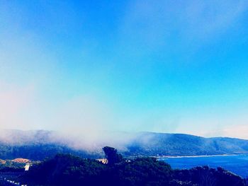 Scenic view of landscape against clear blue sky