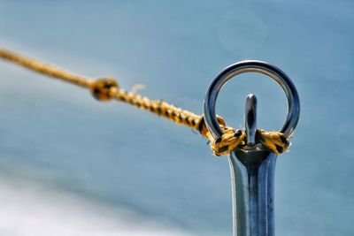 Close-up of rope tied on bollard