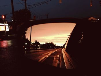 Car on road at sunset