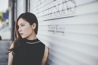 Portrait of young woman looking away